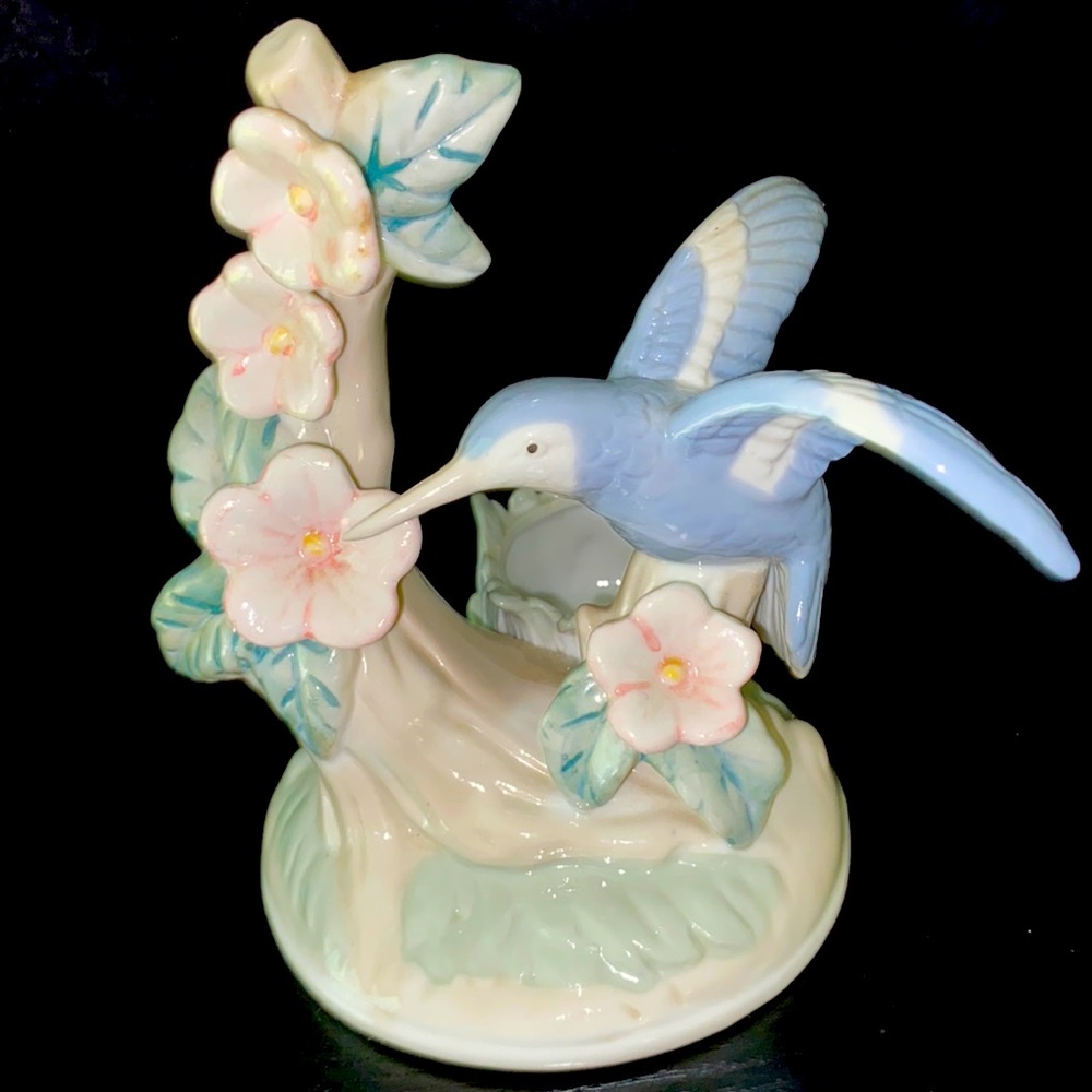 Vintage tea light holder hummingbird with flowers.